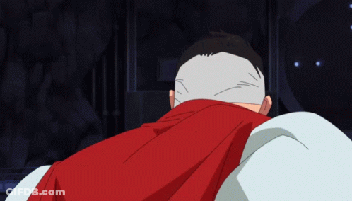 A Man With A Red Cape Covering His Head GIF