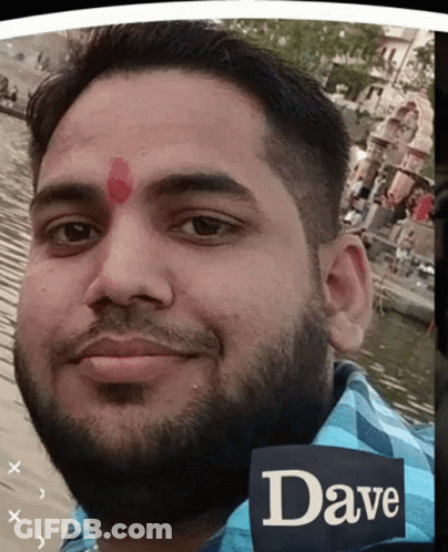 A Man With A Red Dot On His Forehead And The Name Dave On His Shirt GIF