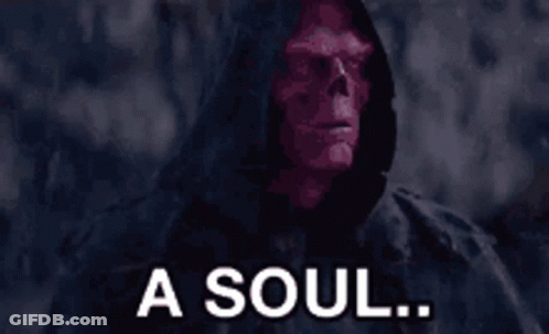 A Man With A Red Face And The Words For A Soul Behind Him GIF
