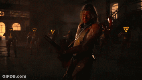 A Man With A Red Face Is Holding A Gun GIF