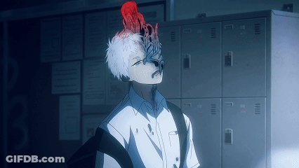 A Man With A Red Flower On His Head Is Standing In Front Of Lockers GIF