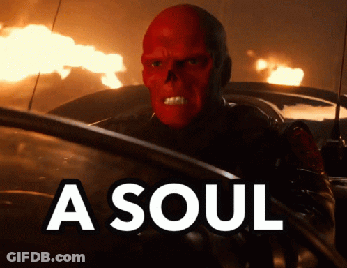 A Man With A Red Skull On His Face Is Driving A Car With The Words A Soul Above Him GIF