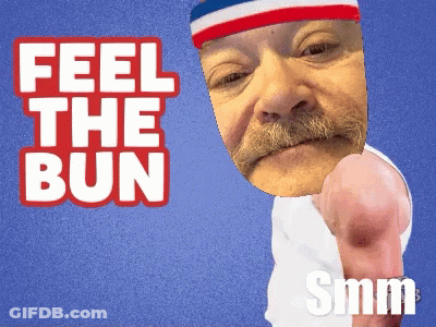 A Man With A Red White And Blue Headband Says Feel The Bun Smm GIF