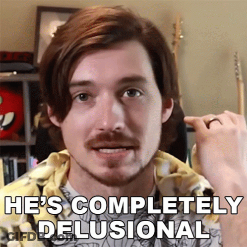 A Man With A Ring On His Finger And The Words He 'S Completely Delusional GIF
