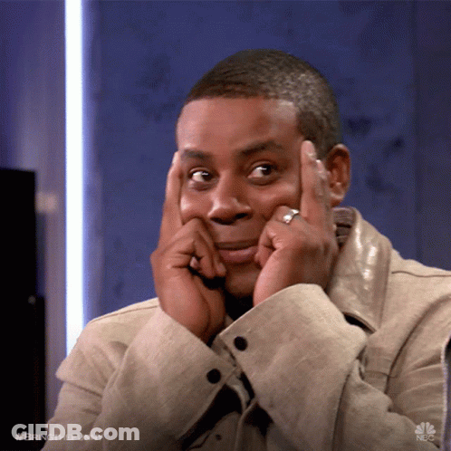 A Man With A Ring On His Finger Holds His Hands To His Face GIF