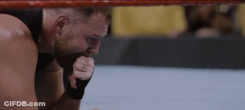 A Man With A Ring On His Finger Is Kneeling In A Boxing Ring GIF