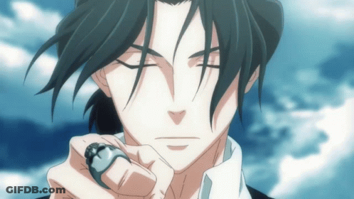 A Man With A Ring On His Finger Is Looking At The Camera GIF