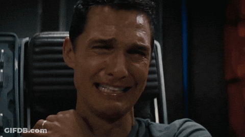 A Man With A Ring On His Finger Is Smiling With His Hand On His Chin GIF