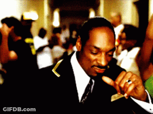 A Man With A Ring On His Finger Is Wearing A Suit GIF