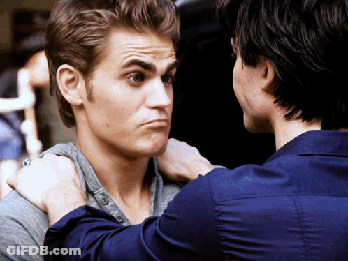 A Man With A Ring On His Finger Looks At Another Man GIF