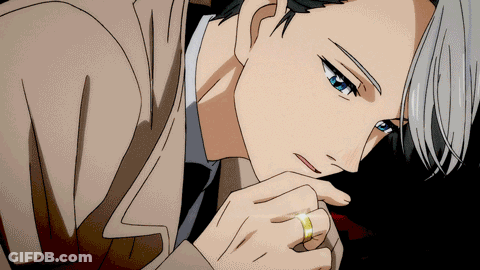 A Man With A Ring On His Finger Looks Down GIF