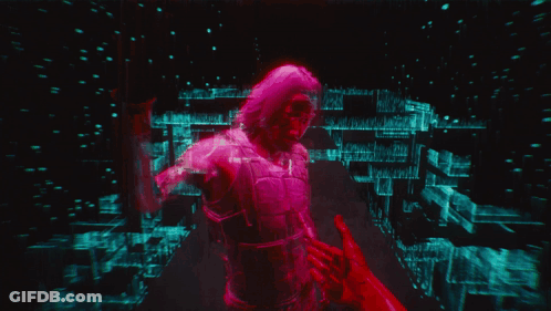 A Man With A Robotic Arm Holding Another Man 'S Hand GIF