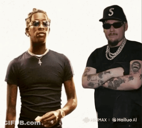 A Man With A S On His Hat Is Standing Next To Another Man GIF