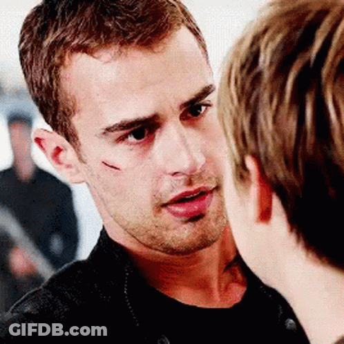 A Man With A Scar On His Face Is Talking To Another Man GIF