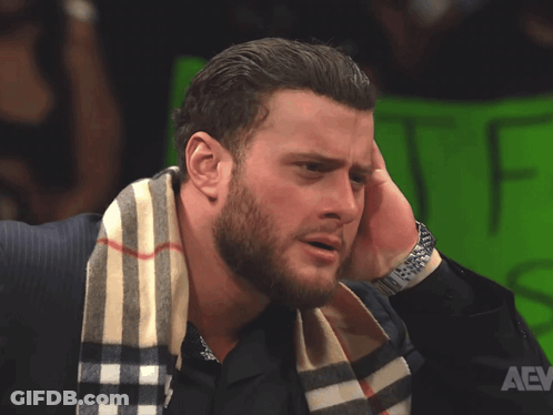 A Man With A Scarf Around His Neck Has A Watch On GIF