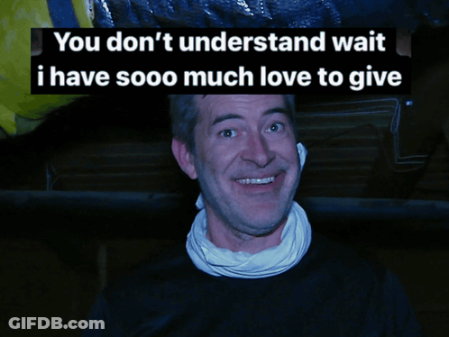 A Man With A Scarf Around His Neck Is Smiling With The Words You Don 'T Understand Wait I Have Sooo Much Love To Give Be GIF