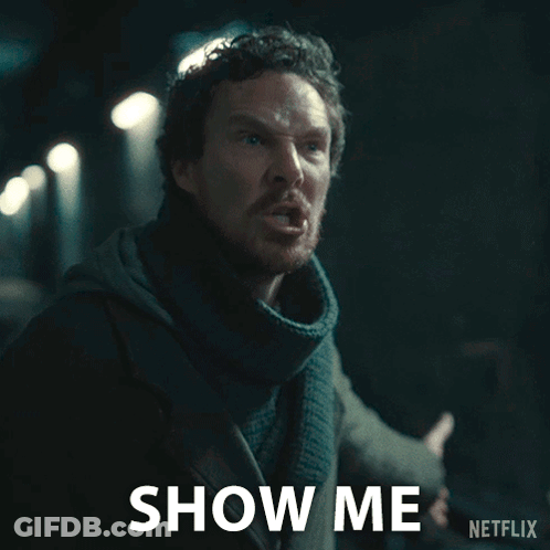 A Man With A Scarf Around His Neck Says Show Me On A Netflix Ad GIF