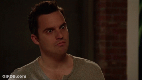 A Man With A Serious Look On His Face Is Next To A Sign That Says What Do You Mean GIF