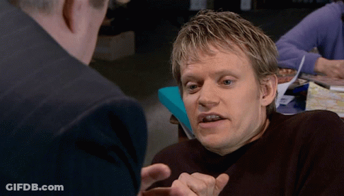 A Man With A Serious Look On His Face Talking To Another Man GIF