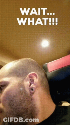A Man With A Shaved Head And The Words Wait What GIF