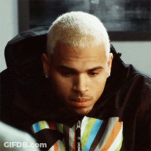 A Man With A Shaved Head Wears A Striped Sweatshirt With The Word Supreme On It GIF