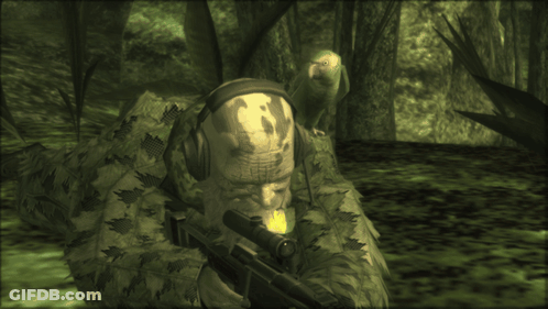 A Man With A Skull On His Head Is Holding A Rifle GIF