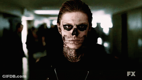 A Man With A Skull Painted On His Face Is Standing In A Dark Hallway With The Fx Logo In The Background GIF