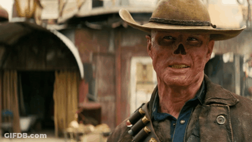 A Man With A Skull Painted On His Face Wearing A Cowboy Hat GIF