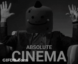 A Man With A Smiley Face On His Head Is Sitting In A Chair With His Hands In The Air And The Words Absolute Cinema Below GIF