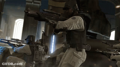 A Man With A Sniper Rifle Has The Letter E On His Chest GIF
