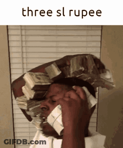 A Man With A Stack Of Money On His Head Is Talking On A Phone GIF