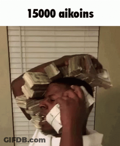 A Man With A Stack Of Money On His Head Talking On A Cell Phone . GIF