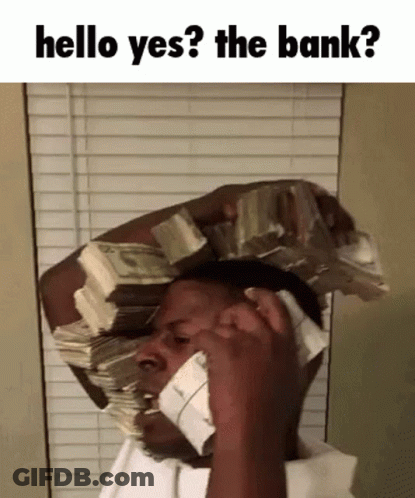 A Man With A Stack Of Money On His Head Talking On A Phone GIF