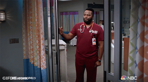 A Man With A Stethoscope Around His Neck Is Standing In A Hospital Room With The Hashtag #Chicagomed On The Bottom GIF