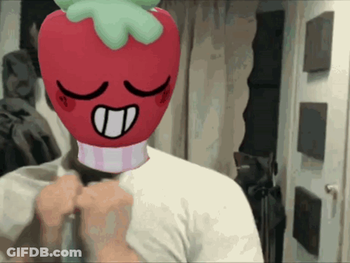 A Man With A Stuffed Strawberry On His Head GIF