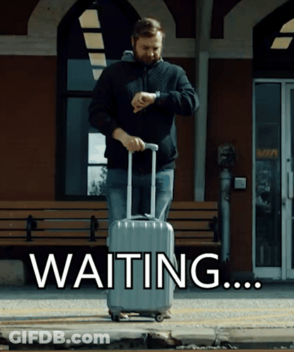 A Man With A Suitcase Is Looking At His Watch And The Word Waiting Is Behind Him GIF