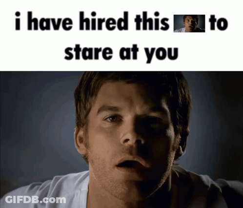 A Man With A Surprised Look On His Face And The Words " I Have Hired This To Stare At You " Above Him GIF