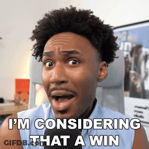 A Man With A Surprised Look On His Face And The Words I 'M Considering That A Win GIF