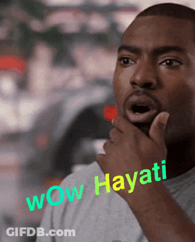 A Man With A Surprised Look On His Face Has Wow Hayati Written On His Chest GIF