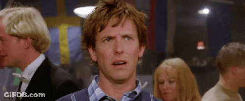 A Man With A Surprised Look On His Face Is In A Crowd Of People GIF