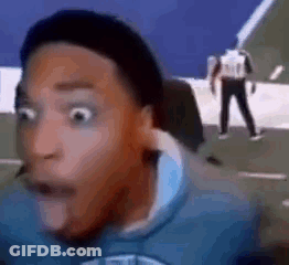 A Man With A Surprised Look On His Face Is Sitting In Front Of A Computer . GIF