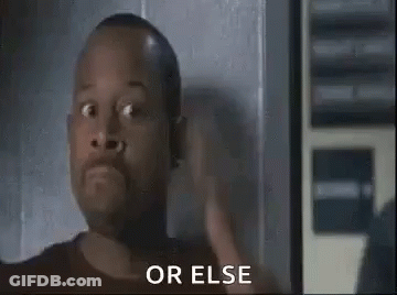 A Man With A Surprised Look On His Face Is Standing In Front Of A Wall . GIF