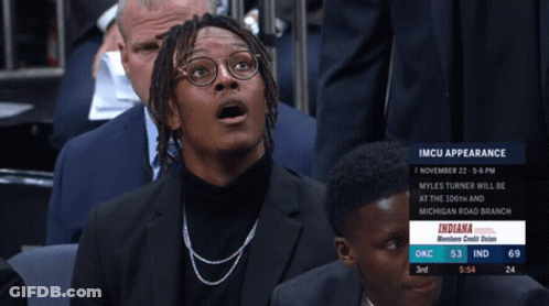 A Man With A Surprised Look On His Face Is Watching A Basketball Game Between Indiana And Okc GIF