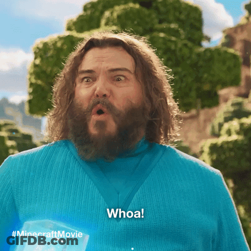 A Man With A Surprised Look On His Face Is Wearing A Blue Shirt That Says Whoa GIF