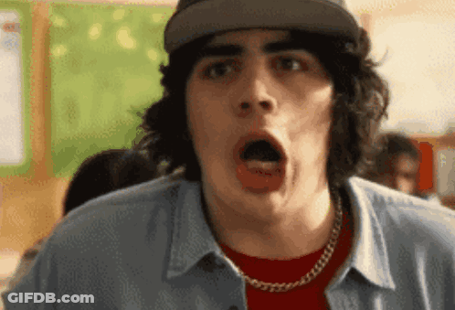 A Man With A Surprised Look On His Face Is Wearing A Hat GIF