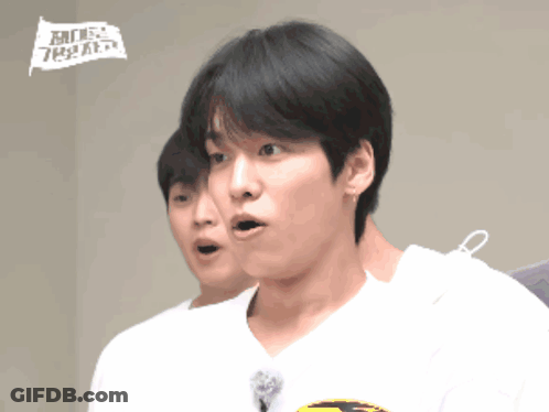 A Man With A Surprised Look On His Face Is Wearing A White Shirt That Says ' Mbc ' On It GIF