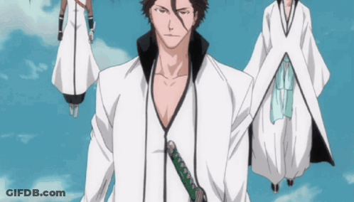 A Man With A Sword In His Hand Stands In Front Of A Group Of People GIF