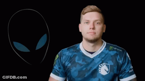 A Man With A Tattoo On His Arm Holds A Pair Of Headphones GIF