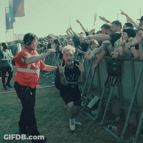 A Man With A Tattoo On His Arm Is Being Escorted By A Security Officer GIF