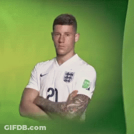 A Man With A Tattoo On His Arm Is Wearing A White Jersey With The Number 21 On It GIF